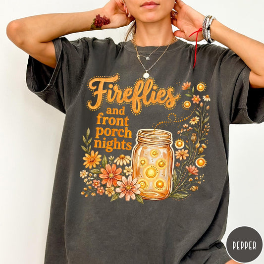 Comfort Colors tee in Pepper featuring rustic style graphic of fireflies in a mason jar with wildflowers