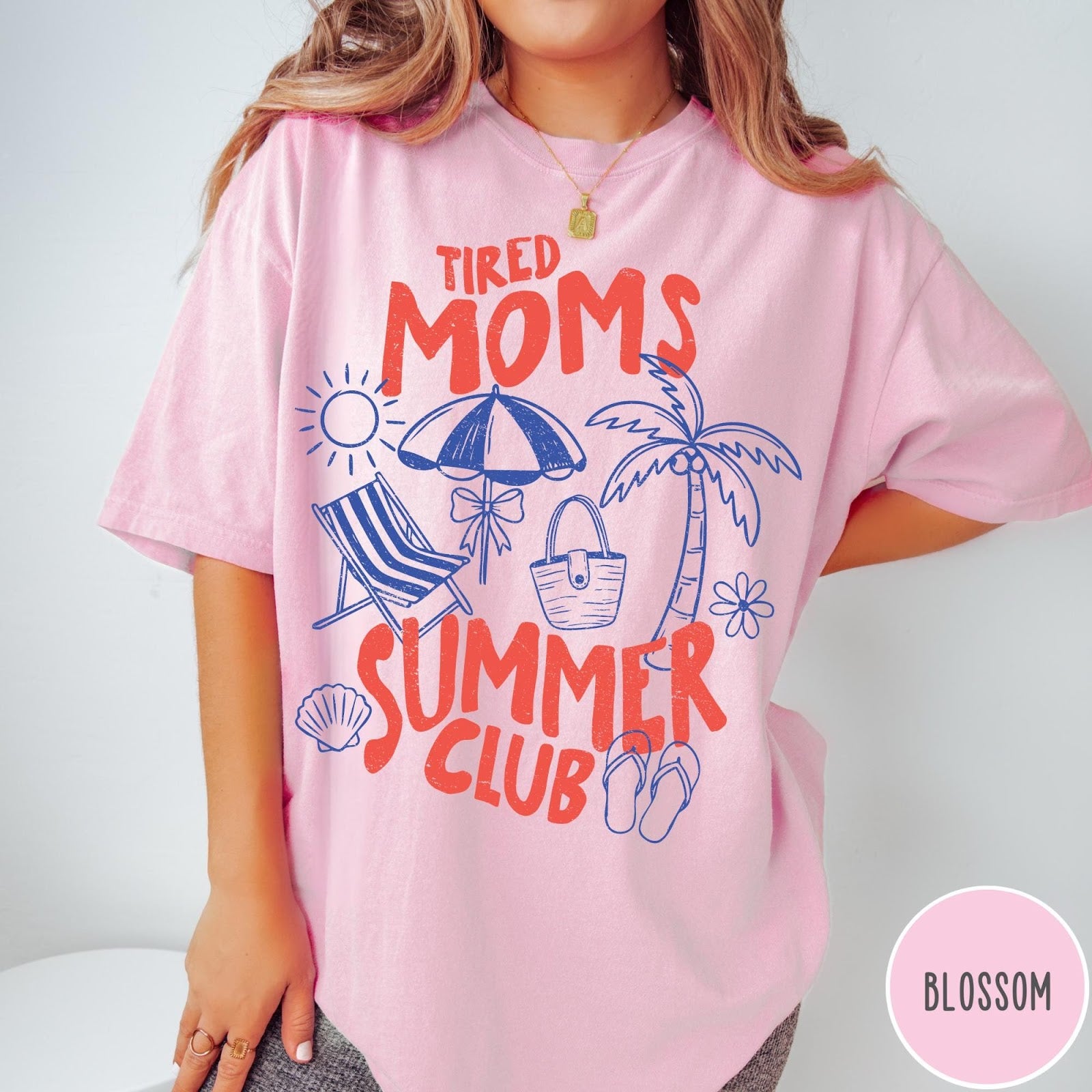 Comfort Colors tee in Blossom featuring beach vacation graphic with sun, palm tree, umbrella, and summer text