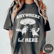 Comfort Colors tee in Pepper featuring whimsical graphic style with two raccoons being abducted by a UFO