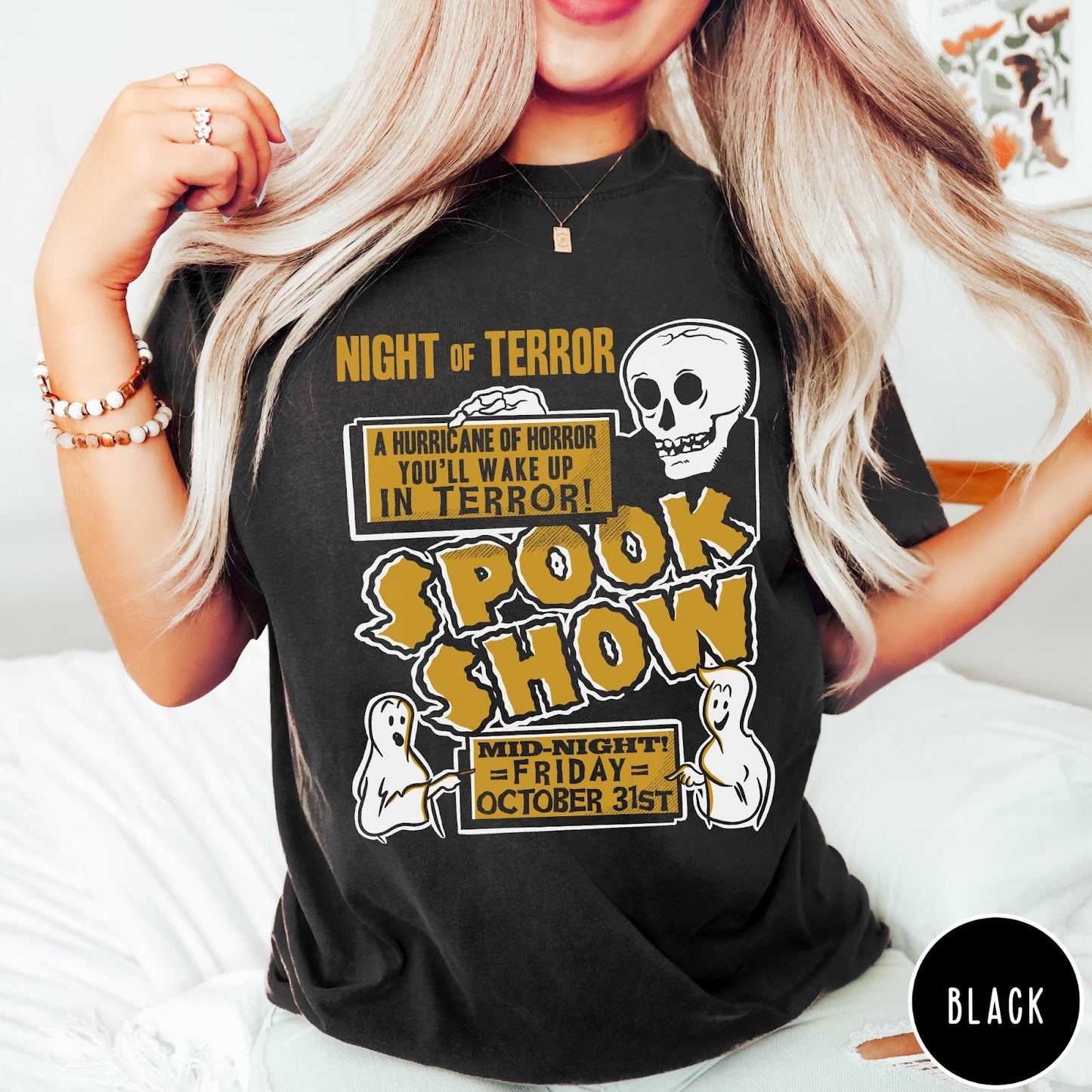 Comfort Colors tee in Black featuring retro horror movie poster graphic with skull and spooky ghost illustrations