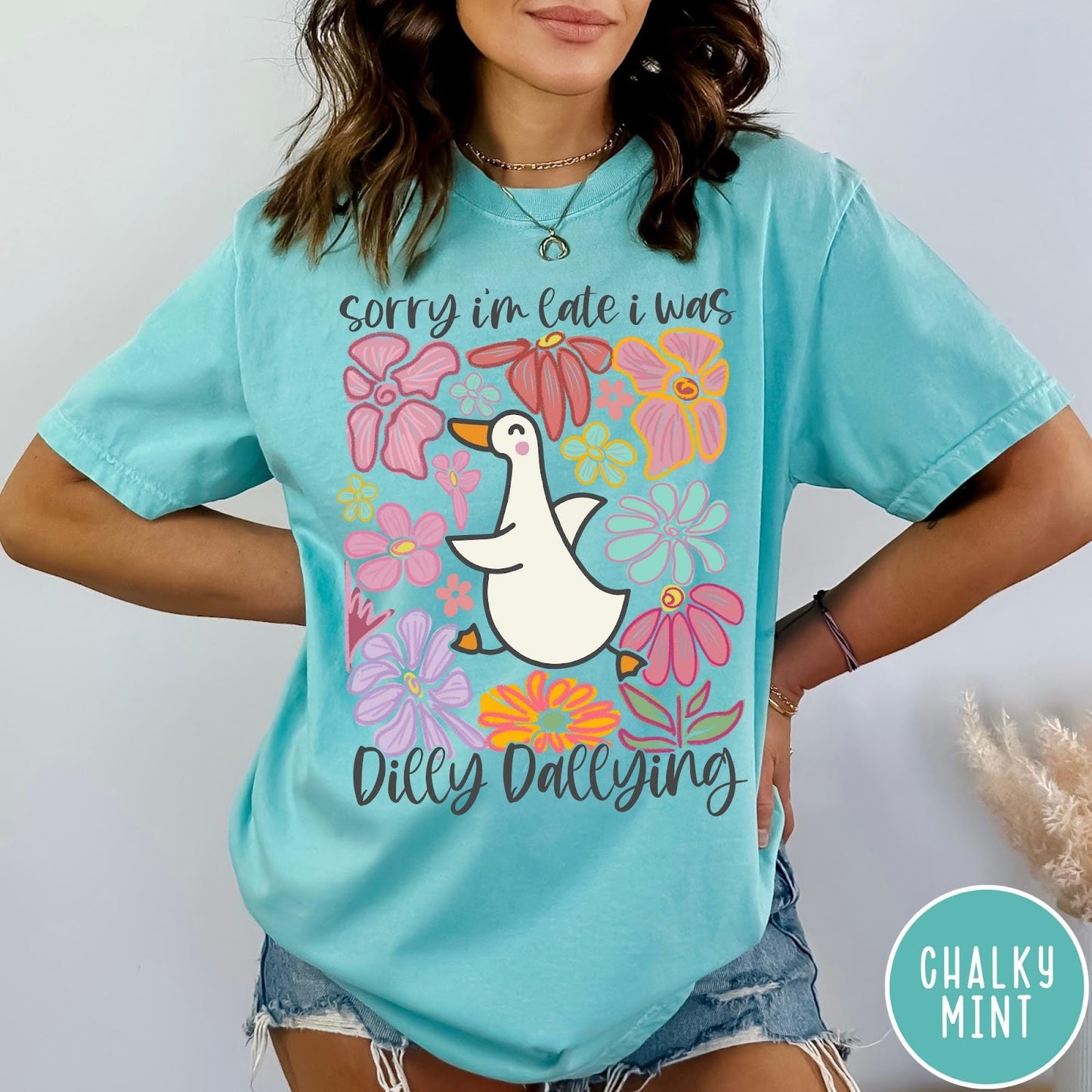 Comfort Colors tee in Chalky Mint featuring cute duck graphic with colorful flowers and Sorry I Was Dilly Dallying text