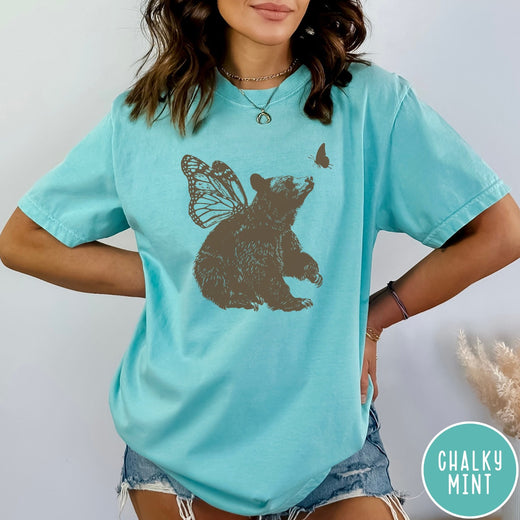 Comfort Colors tee in Chalky Mint featuring vintage style graphic of a bear with butterfly wings and butterfly