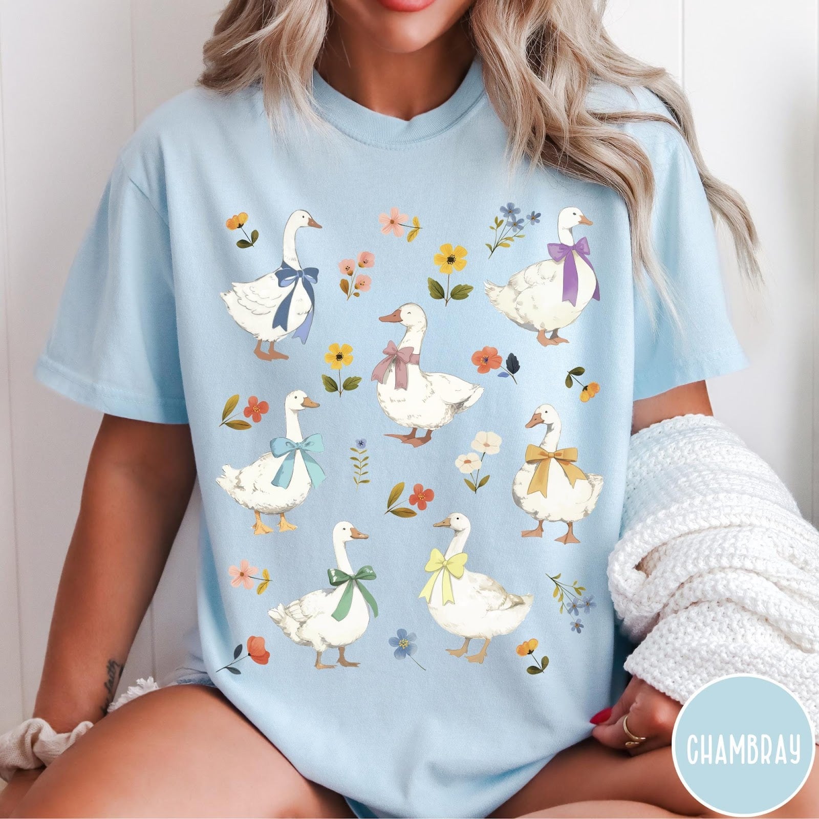 Comfort Colors tee in Chambray featuring vintage style graphic of several white geese wearing colorful bows and flowers