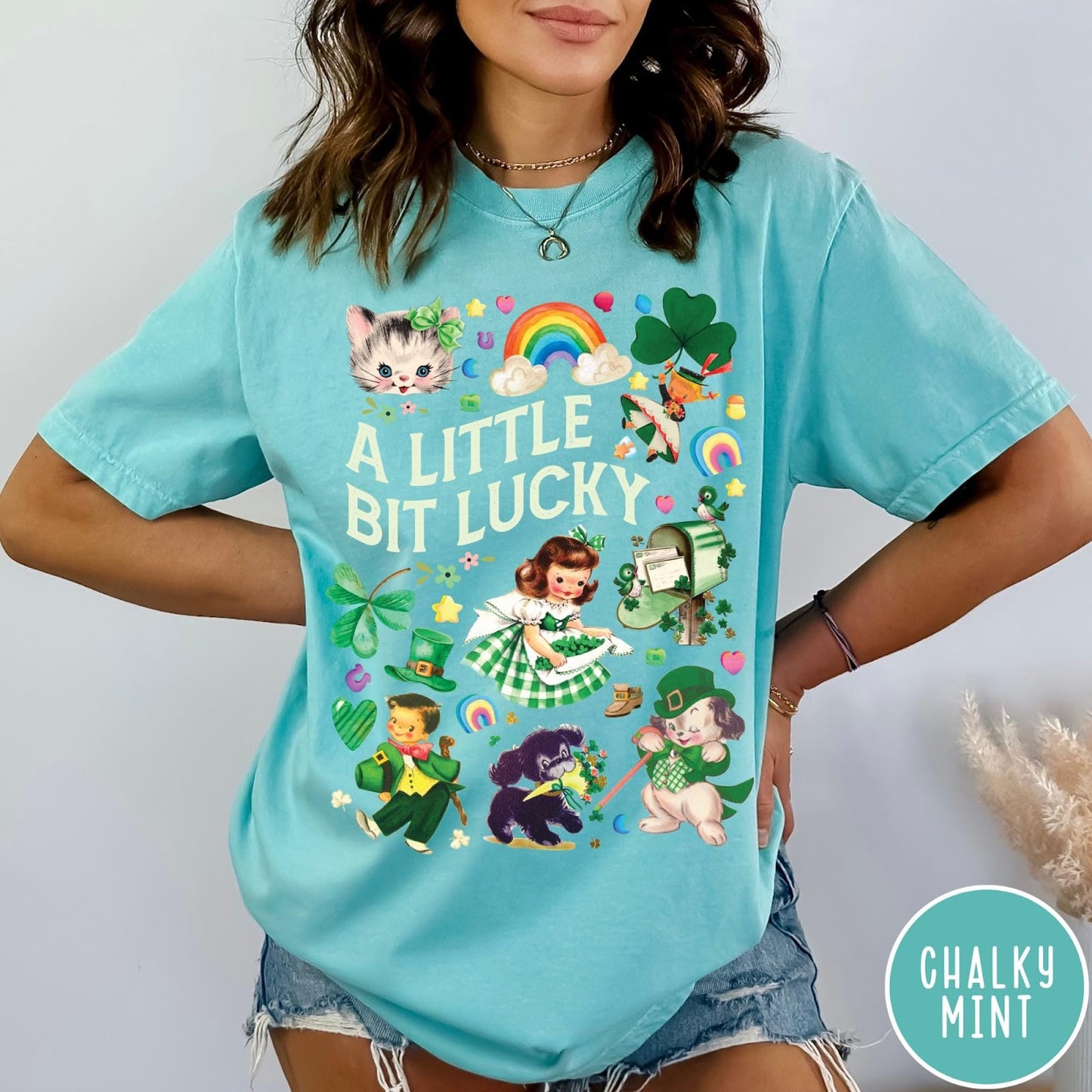 Comfort Colors tee in Chalky Mint featuring St. Patrick's Day collage with vintage characters and lucky symbols