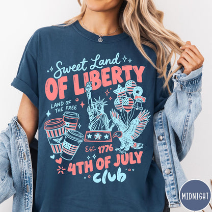 Comfort Colors tee in Midnight featuring 4th of July celebration graphic with Statue of Liberty and eagle
