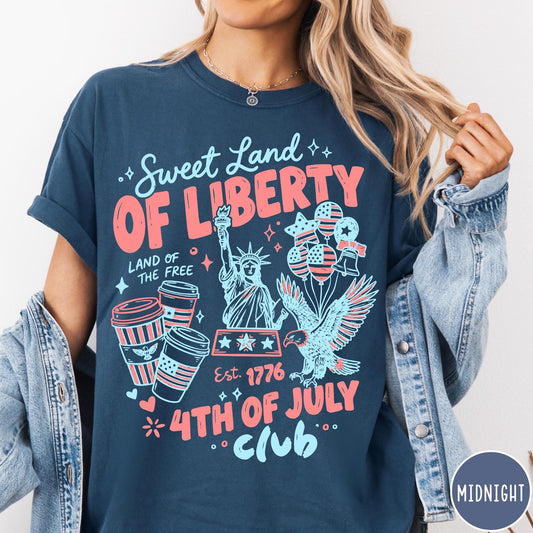 Comfort Colors tee in Midnight featuring 4th of July celebration graphic with Statue of Liberty and eagle