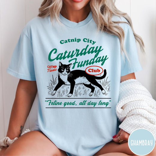 Comfort Colors tee in Chambray featuring vintage style graphic of a tuxedo cat in grass with text