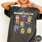 Comfort Colors tee in Pepper featuring retro style graphic with jam jars labeled with inclusion and advocacy terms