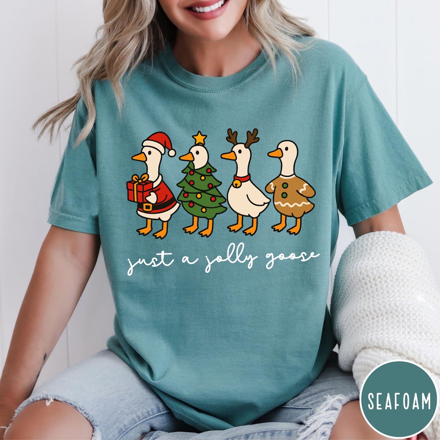 Comfort Colors tee in Seafoam featuring festive geese graphic with Santa, Christmas tree, reindeer, and gingerbread goose designs