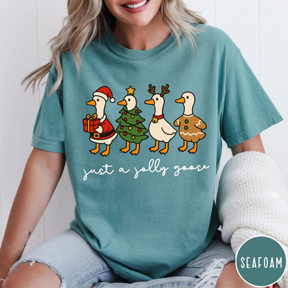 Comfort Colors tee in Seafoam featuring festive geese graphic with Santa, Christmas tree, reindeer, and gingerbread goose designs