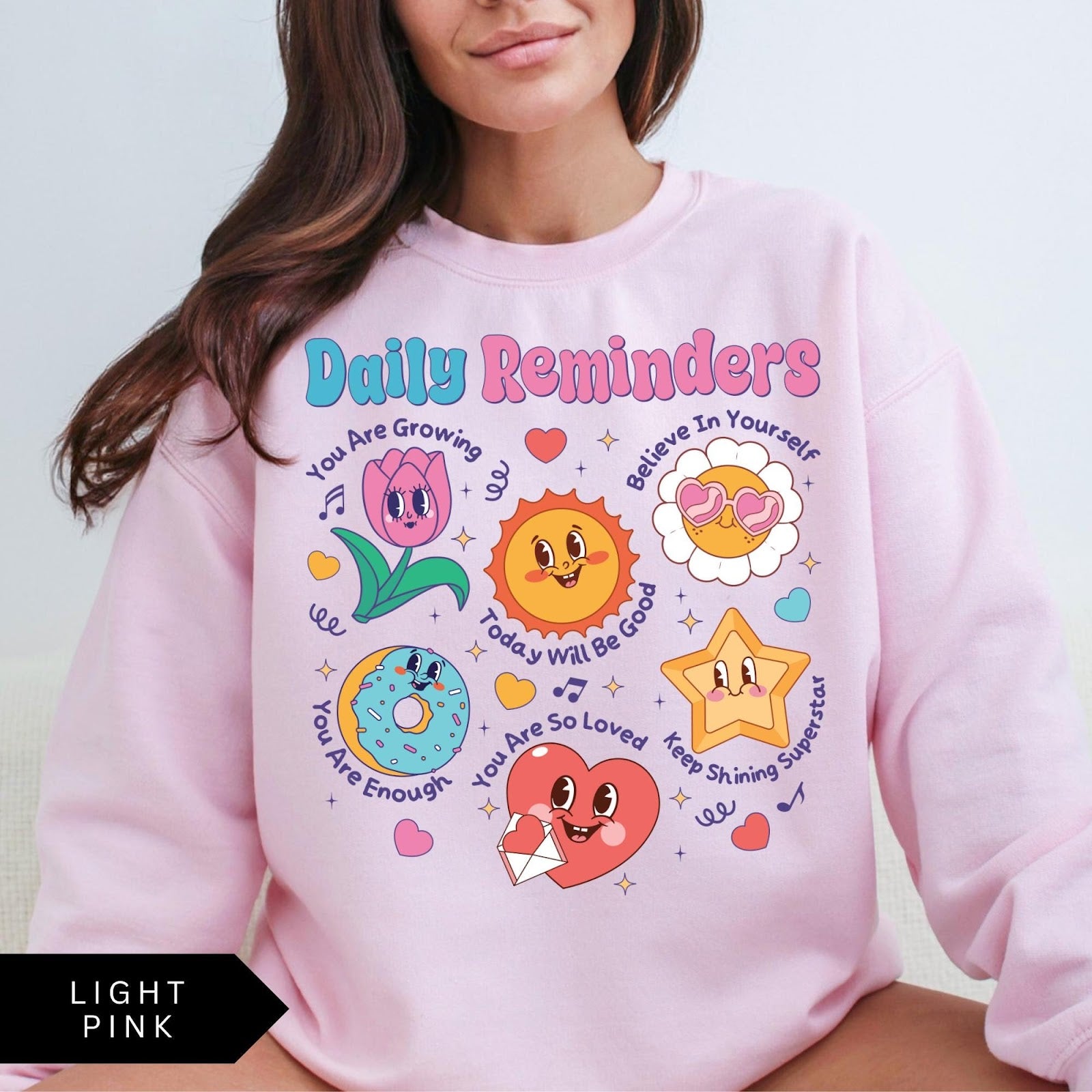 Comfort Colors tee in Light Pink featuring retro mascot design with daily affirmations and cute cartoon characters