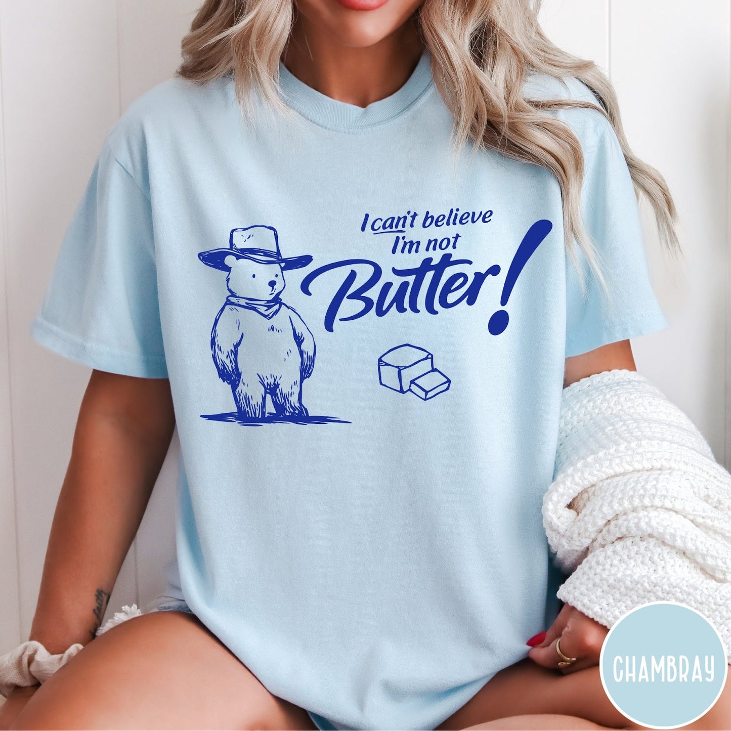 Comfort Colors tee in Chambray featuring bear graphic with cowboy hat and text I can't believe I'm not Butter