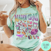 Comfort Colors tee in Island Reef featuring vintage style Mardi Gras icons including a saxophone, mask, and umbrella.