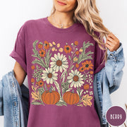 Comfort Colors tee in Berry featuring boho floral design with pumpkins and daisies in fall colors