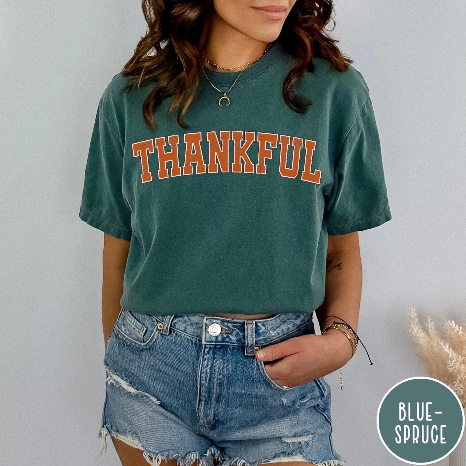 Comfort Colors tee in Blue Spruce featuring typography graphic with the word Thankful in an arched varsity style