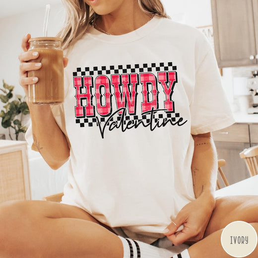 Comfort Colors tee in Ivory featuring western Valentine greeting with Howdy Valentine text and checkered border graphic
