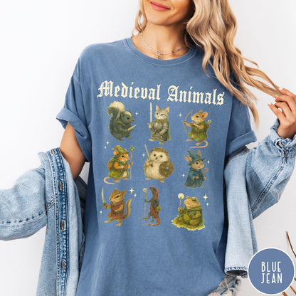 Comfort Colors tee in Blue Jean featuring medieval animals graphic with fantasy characters including a cat, hedgehog, and frog