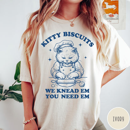 Comfort Colors tee in Ivory featuring cat baking biscuits graphic with chef hat and rolling pin illustration