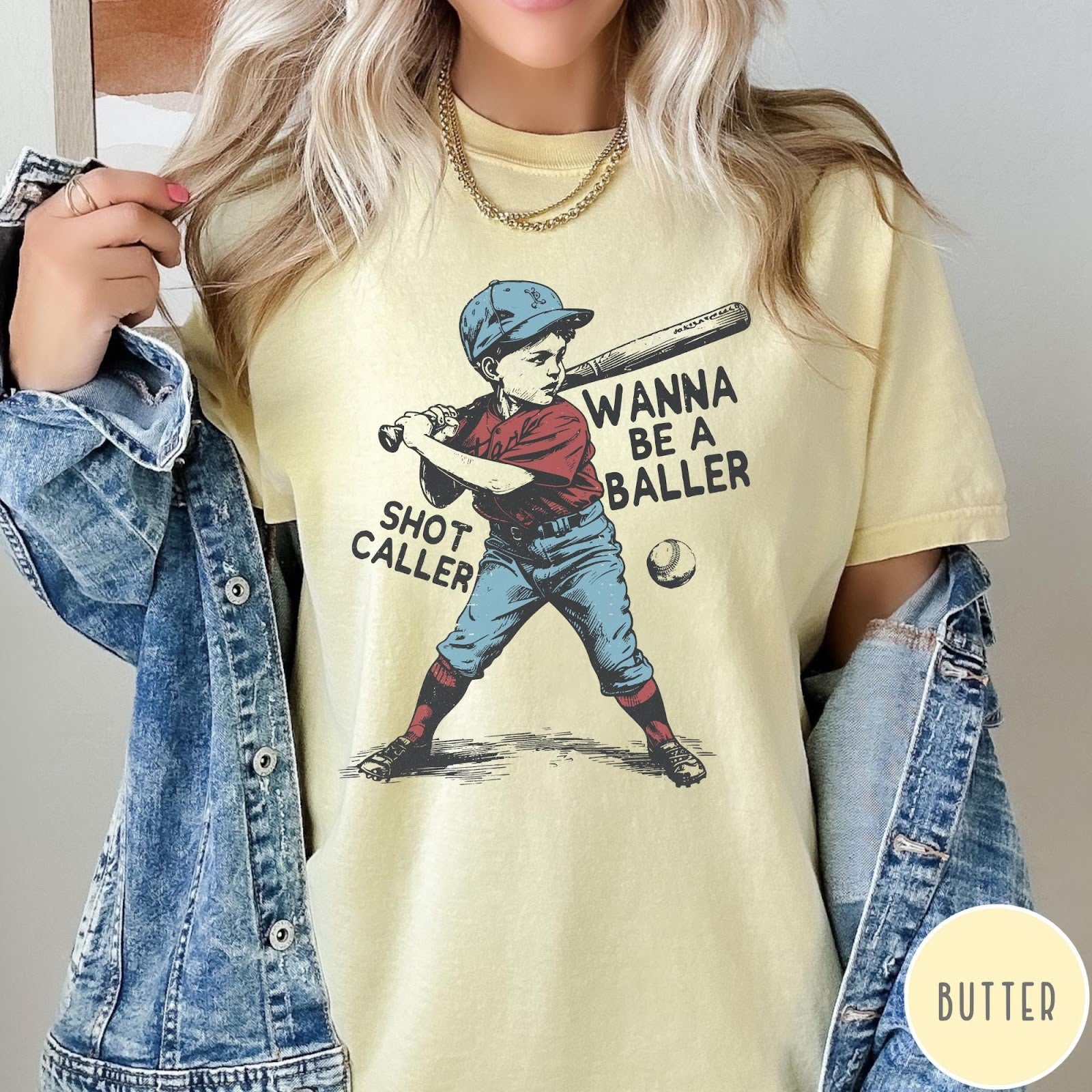 Comfort Colors tee in Butter featuring vintage style baseball player graphic with Wanna Be a Baller text