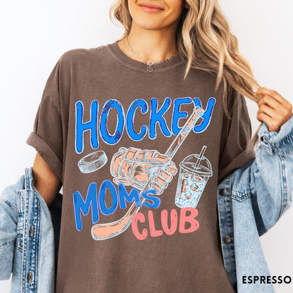 Comfort Colors tee in Espresso featuring hockey mom lifestyle graphic with hockey glove, puck, and drink