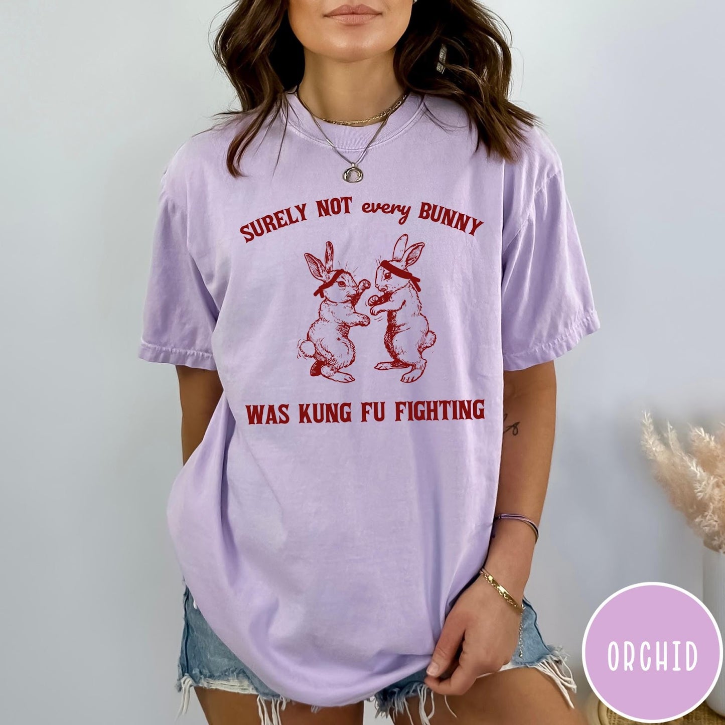 Comfort Colors tee in Orchid featuring vintage style graphic of two rabbits wearing headbands kung fu fighting
