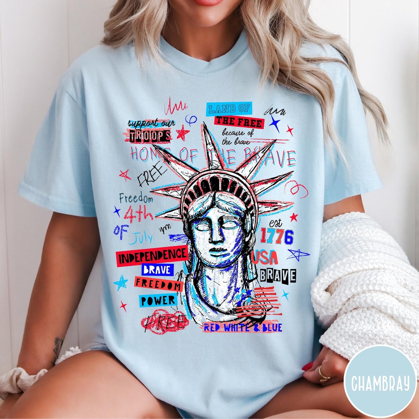 Comfort Colors tee in Chambray featuring grunge style Statue of Liberty graphic with patriotic red and blue text