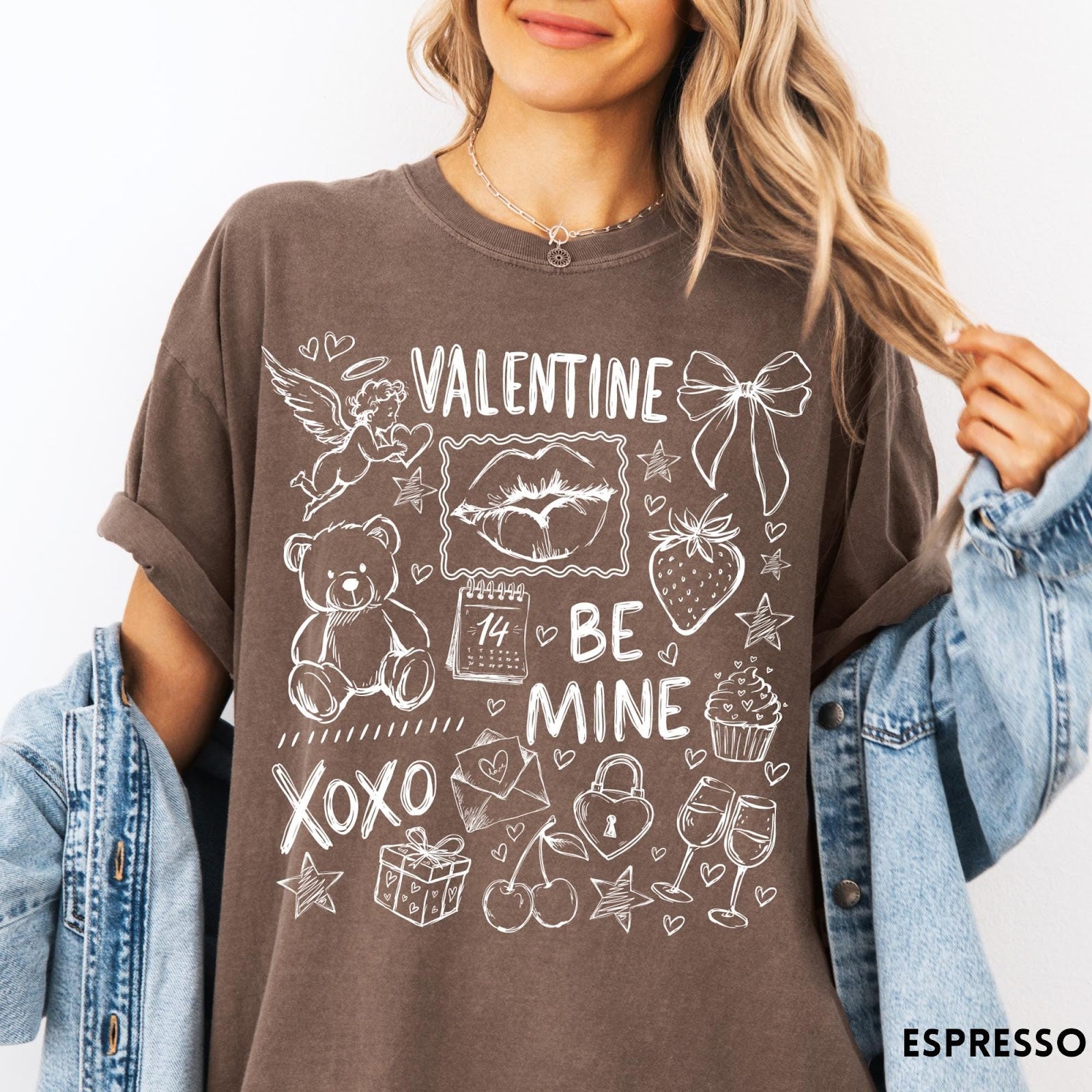Comfort Colors tee in Espresso featuring Valentine's Day collage graphic with cupid, teddy bear, and romantic symbols