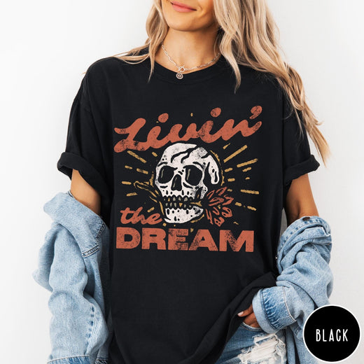 Comfort Colors tee in Black featuring vintage style skull graphic with Livin the Dream text design