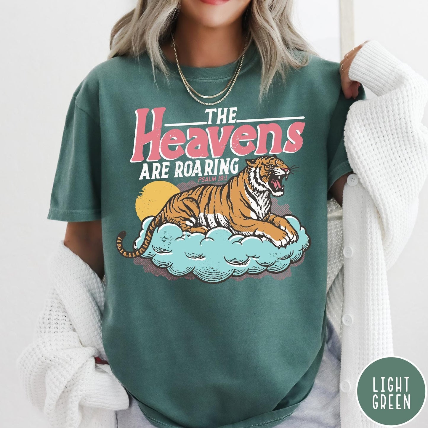 Comfort Colors tee in Light Green featuring retro graphic design of a roaring tiger resting on a cloud