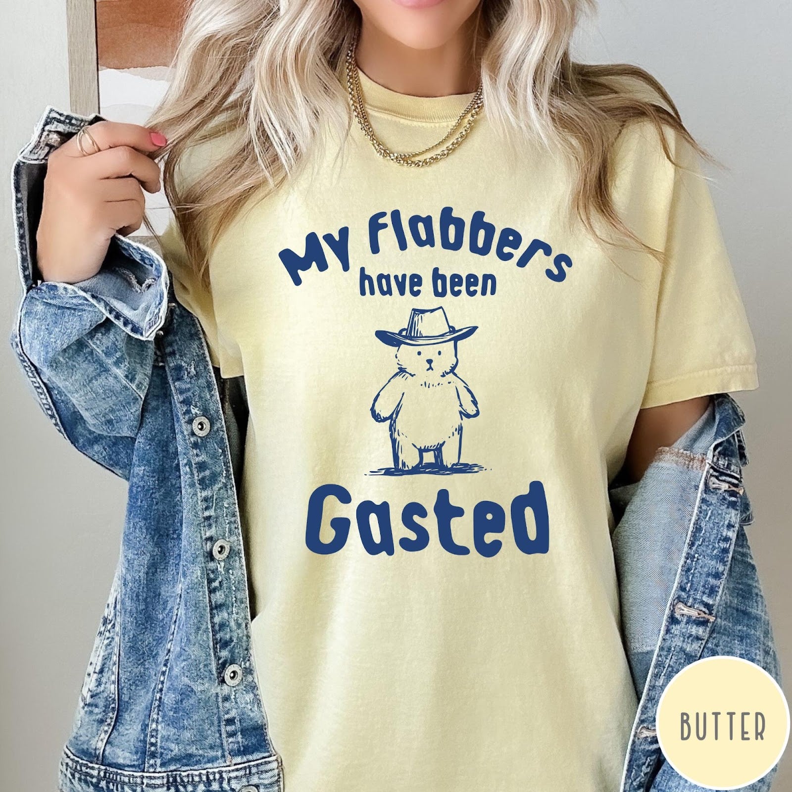 Comfort Colors tee in Butter featuring illustrated style bear wearing a cowboy hat and text graphic