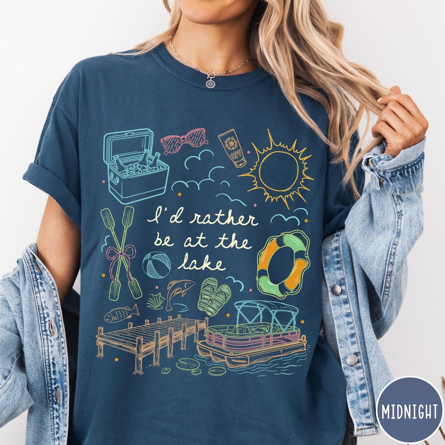 Comfort Colors tee in Midnight featuring lake vacation graphic with pontoon boat, dock, and summer accessories