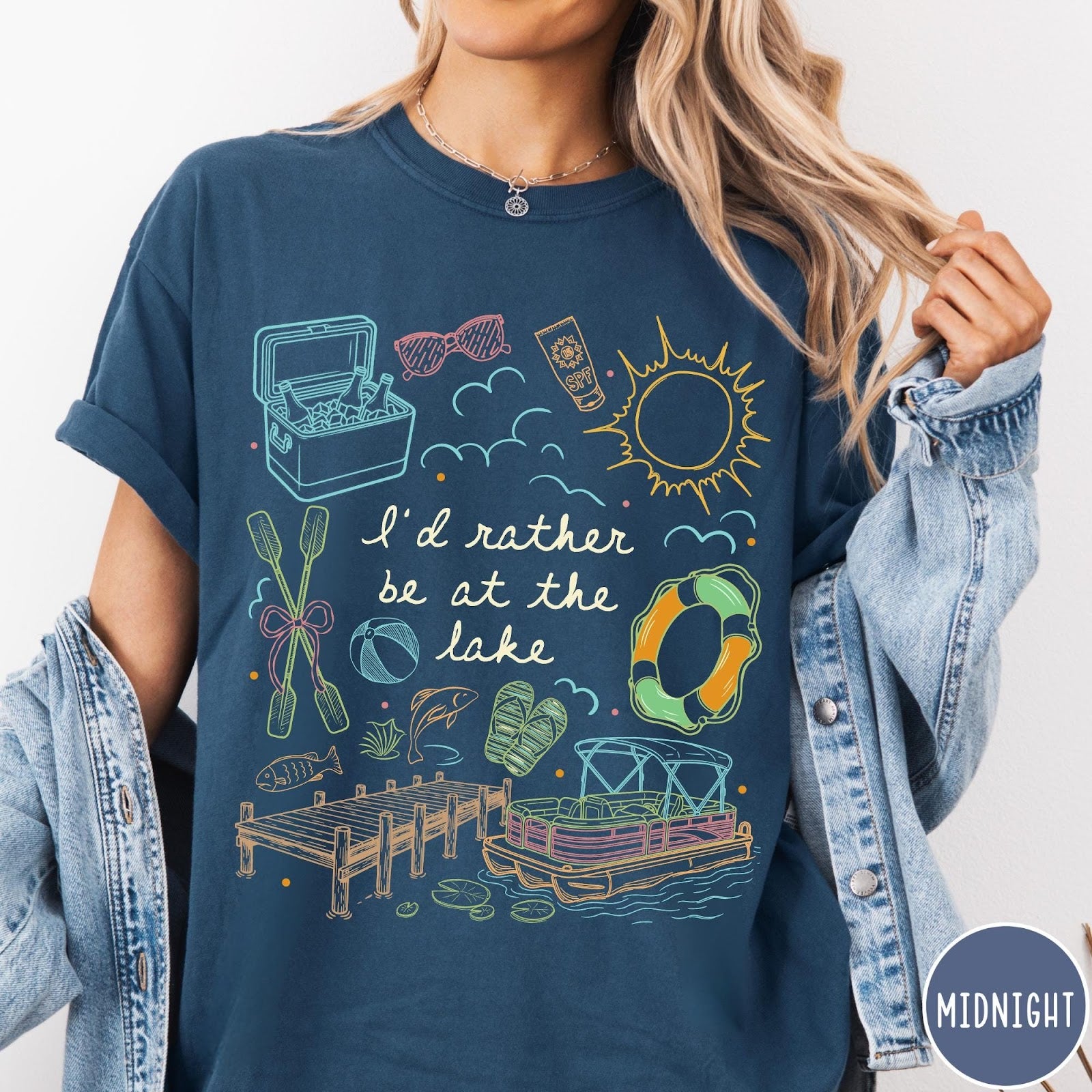 Comfort Colors tee in Midnight featuring lake vacation graphic with pontoon boat, dock, and summer accessories