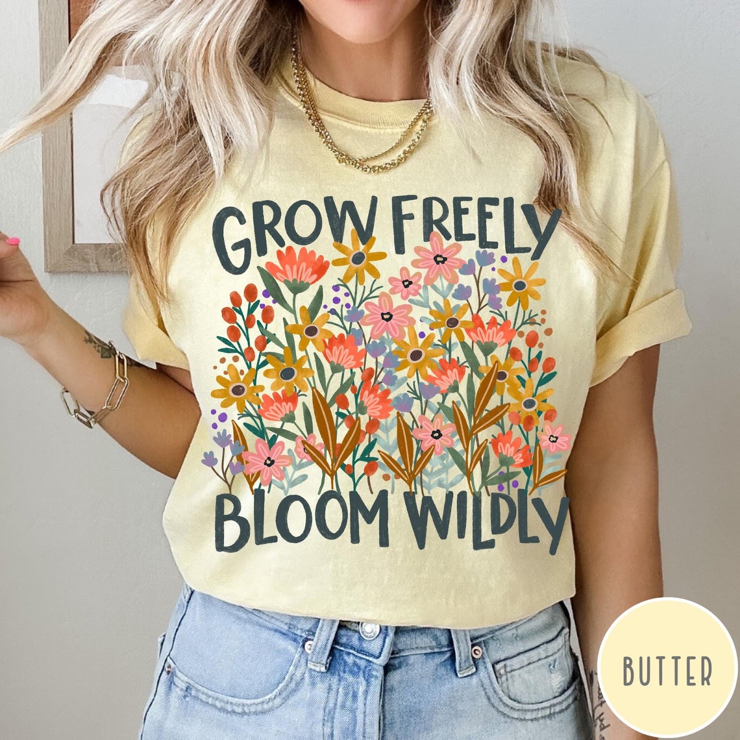 Comfort Colors tee in Butter featuring wildflower design with colorful flowers and Grow Freely Bloom Wildly text