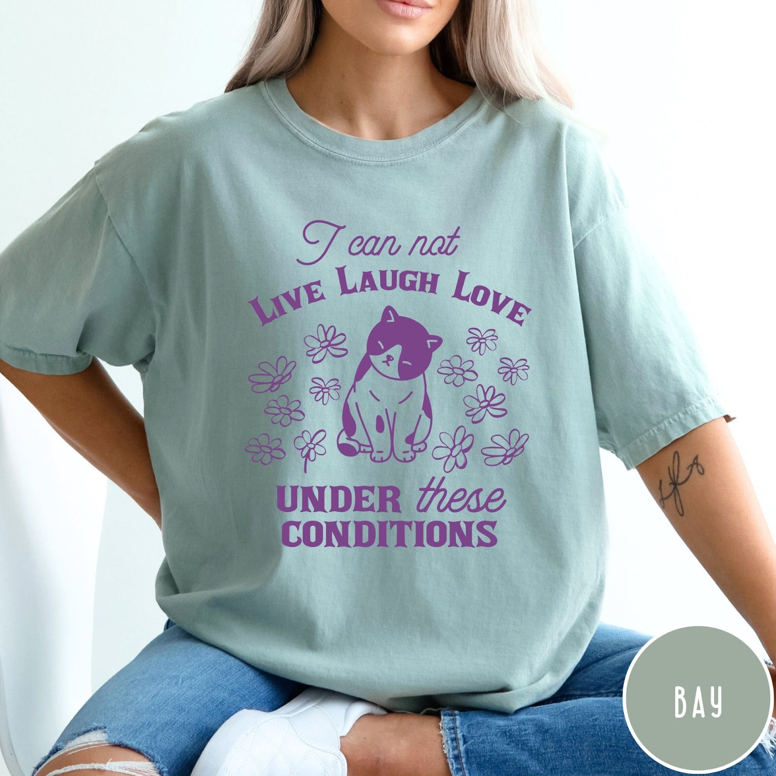 Comfort Colors tee in Bay featuring whimsical graphic style with a cat and flowers and text.