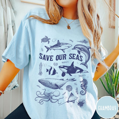 Comfort Colors tee in Chambray featuring marine life graphic design with various sea creatures and Save Our Seas text
