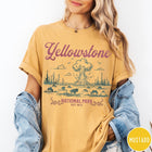 Comfort Colors tee in Mustard featuring retro graphic design of Yellowstone National Park with bison and geyser