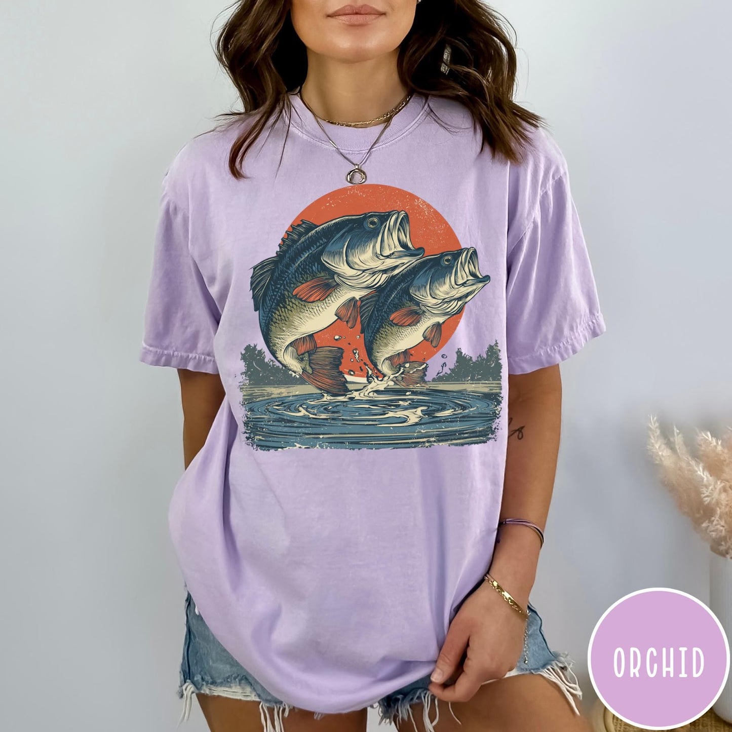 Comfort Colors tee in Orchid featuring vintage style graphic of two bass fish jumping from water