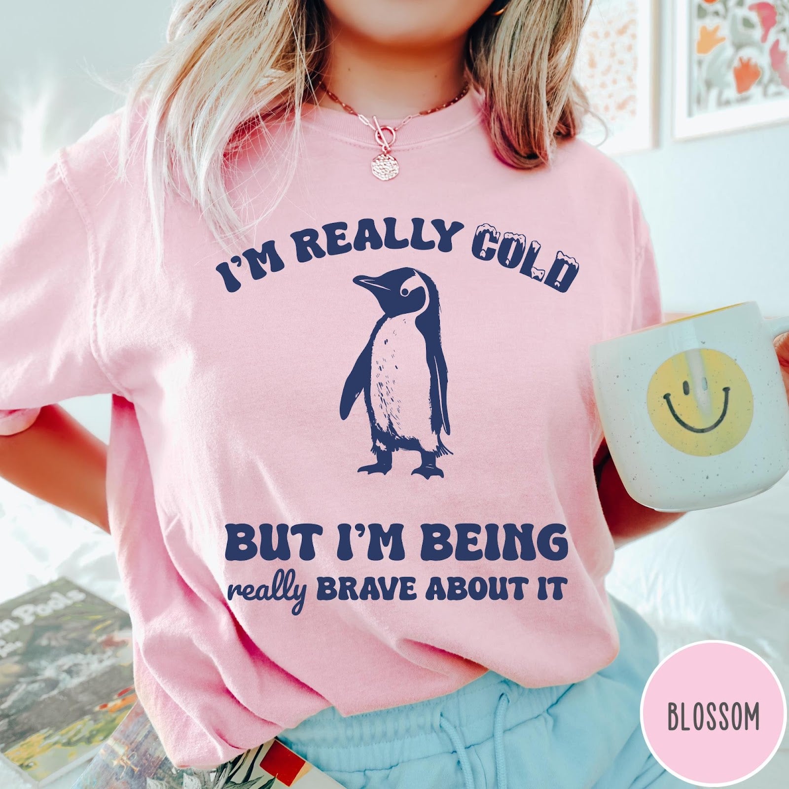 Comfort Colors tee in Blossom featuring penguin graphic with text I am really cold but I am brave