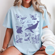 Comfort Colors tee in Chambray featuring vintage style graphic of various animals with butterfly wings and clouds