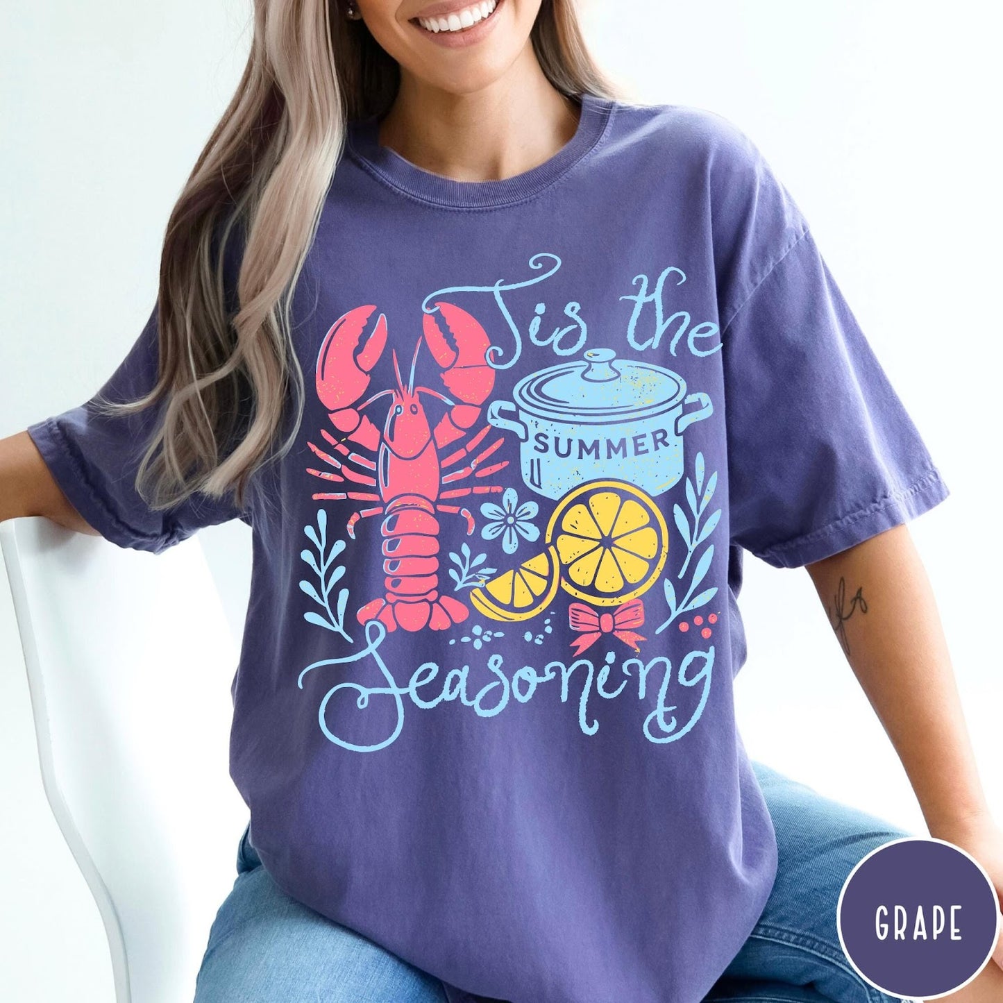 Comfort Colors tee in Grape featuring lobster boil graphic with lobster, pot, and lemon slices