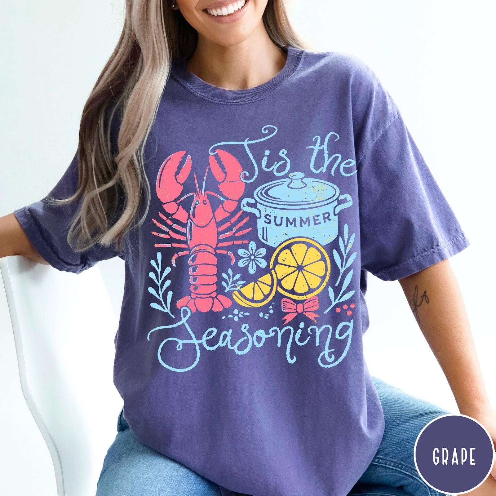 Comfort Colors tee in Grape featuring lobster boil graphic with lobster, pot, and lemon slices