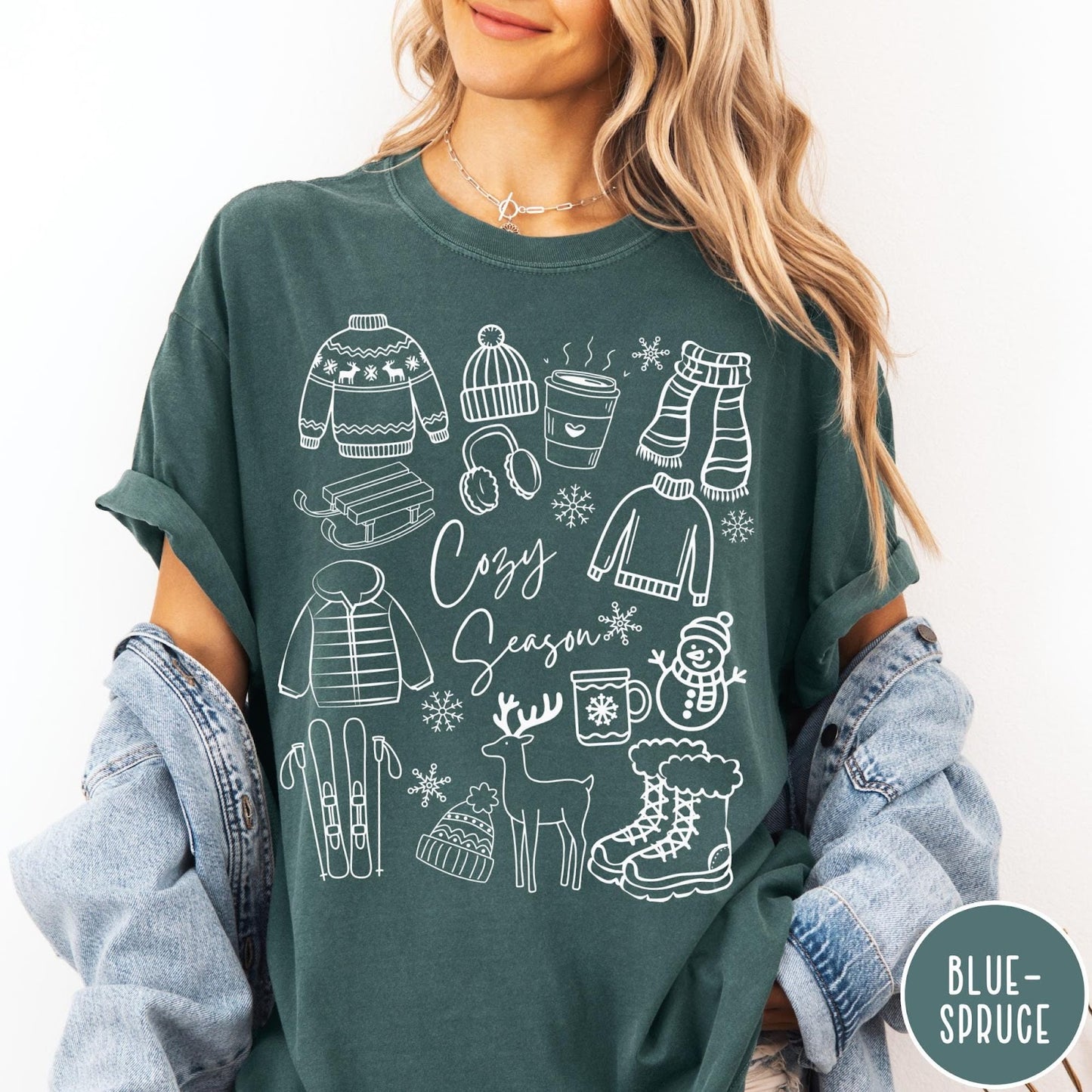 Comfort Colors tee in Blue Spruce featuring line art winter activities and seasonal items graphic design