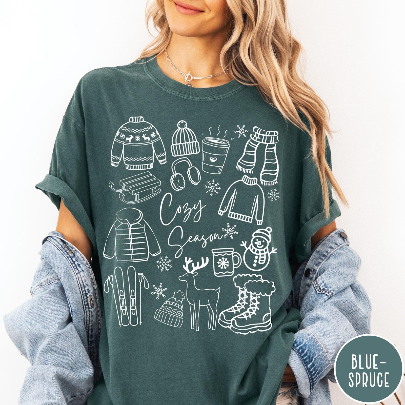 Comfort Colors tee in Blue Spruce featuring line art winter activities and seasonal items graphic design