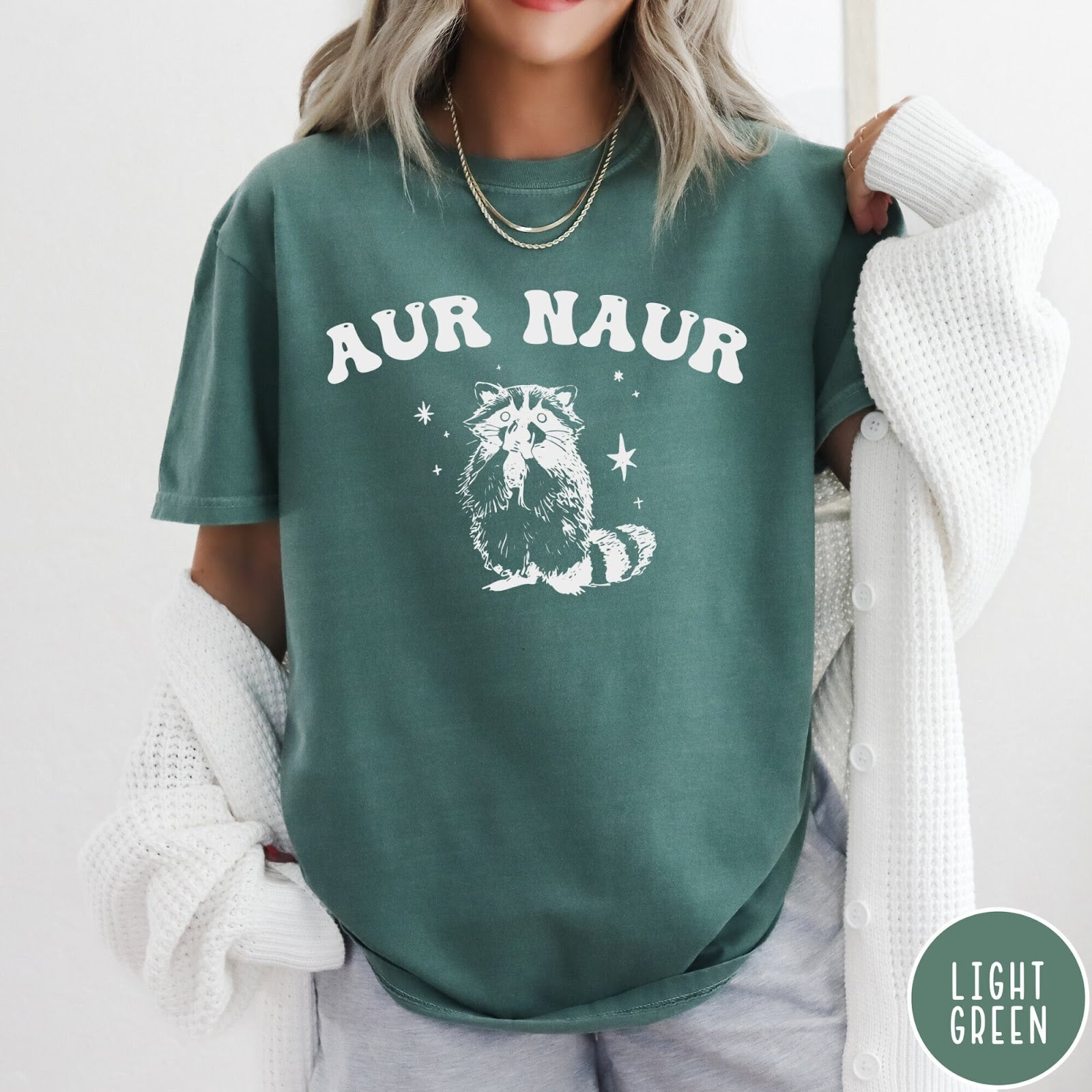 Comfort Colors tee in Light Green featuring retro style graphic of a raccoon with stars and text