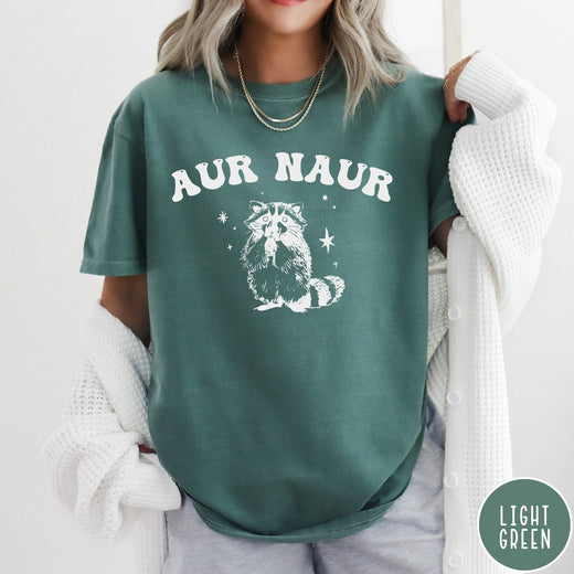 Comfort Colors tee in Light Green featuring retro style graphic of a raccoon with stars and text
