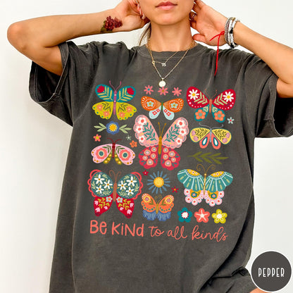 Comfort Colors tee in Pepper featuring butterfly and floral graphic design with Be Kind to all kinds text