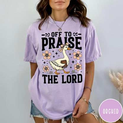 Comfort Colors tee in Orchid featuring retro style graphic of a goose wearing a bow holding a book