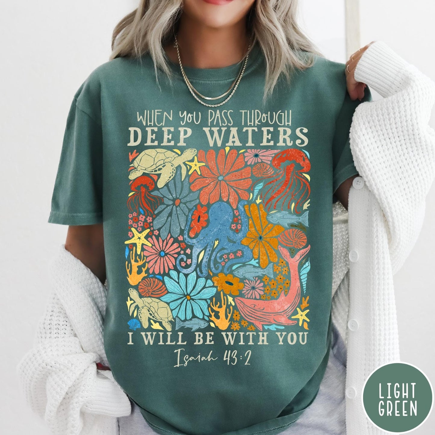 Comfort Colors tee in Light Green featuring artistic marine life graphic with Isaiah 43:2 Bible verse text