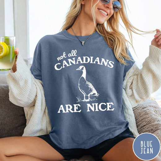 Comfort Colors tee in Blue Jean featuring casual graphic design of a Canada goose and humorous text