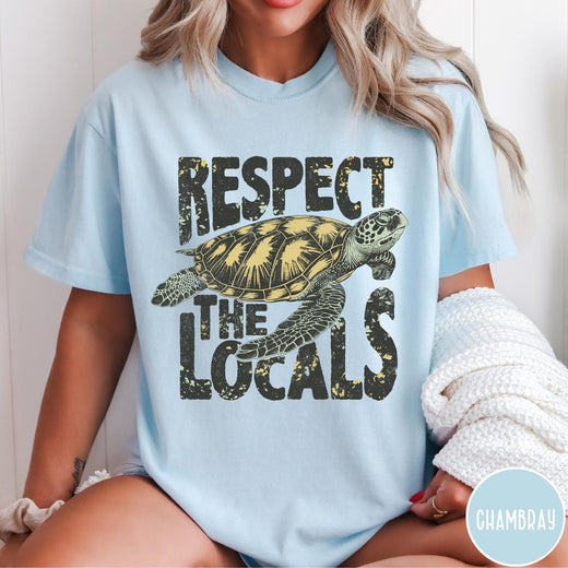 Comfort Colors tee in Chambray featuring vintage style sea turtle graphic with Respect the Locals text